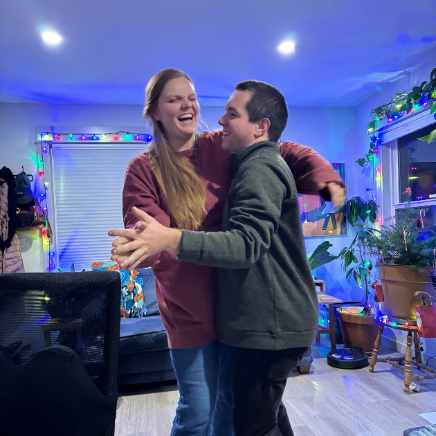 Lisa and Paul dancing in the living room