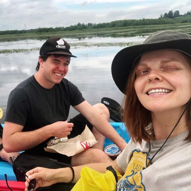 Lisa and Paul picnicking on a kayak